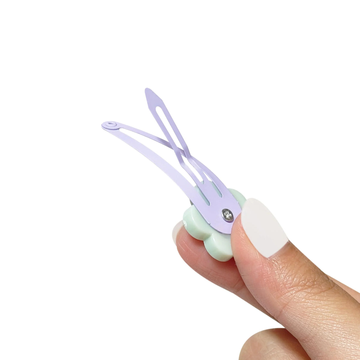 LuvHer Shop pastel flower hair clip for girls with rhinestone detail, held by hand