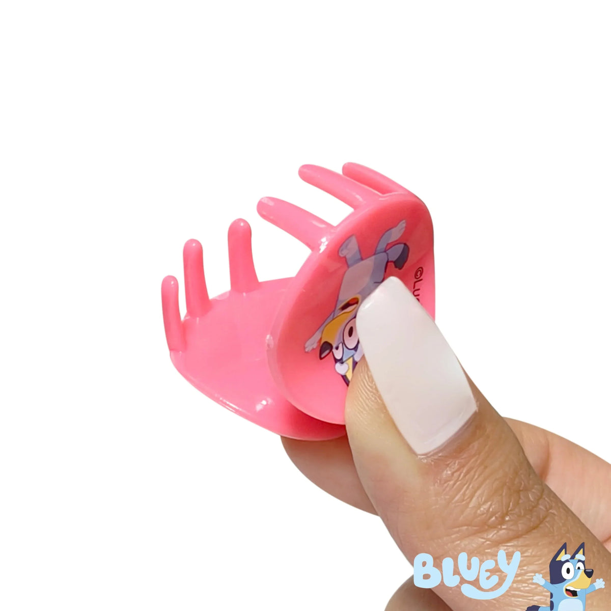 Bluey Pink Hair Claw Clip with cartoon design held by hand, official LuvHer Shop girls' accessory
