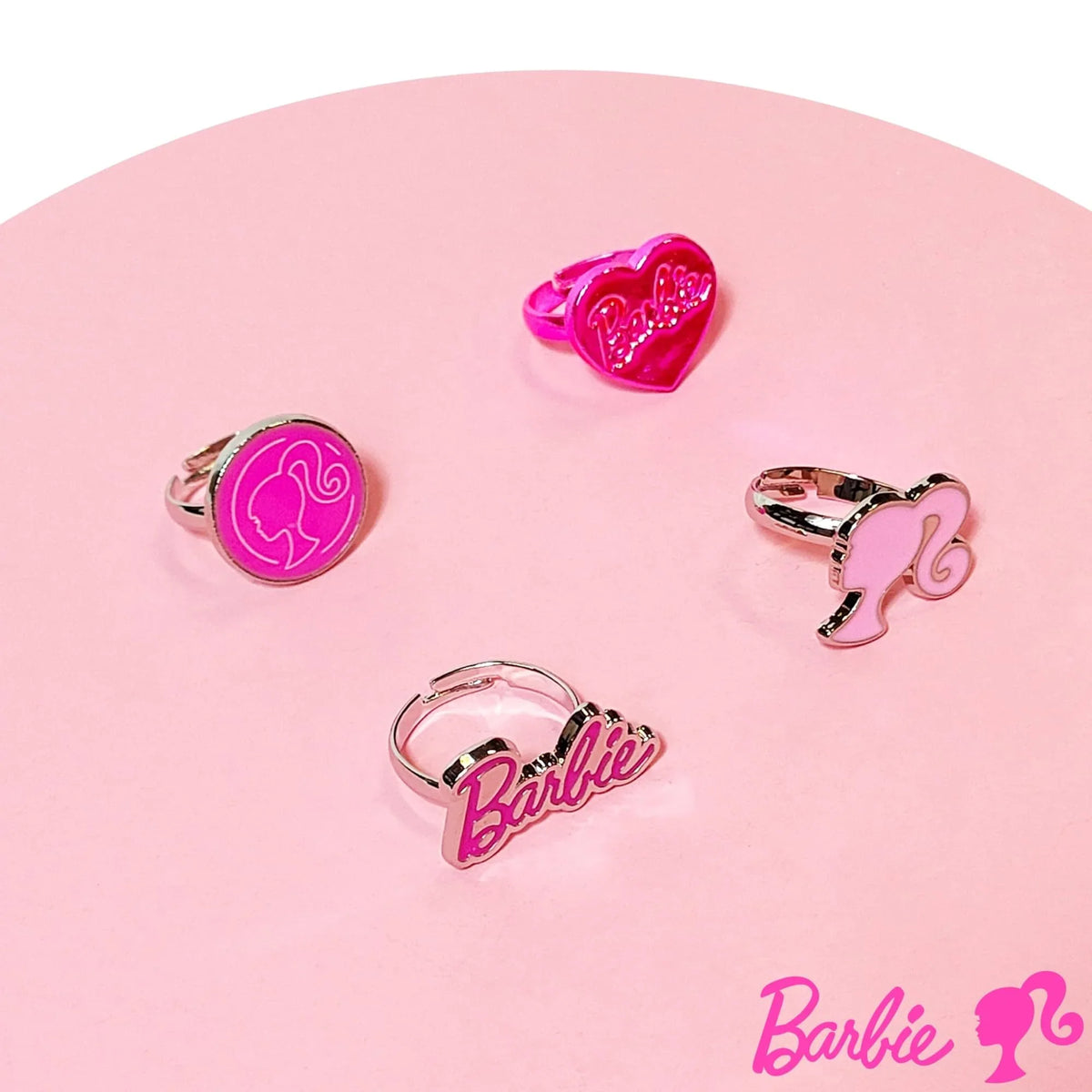 Barbie adjustable rings set for girls, featuring pink Barbie logo and silhouette designs on pink background