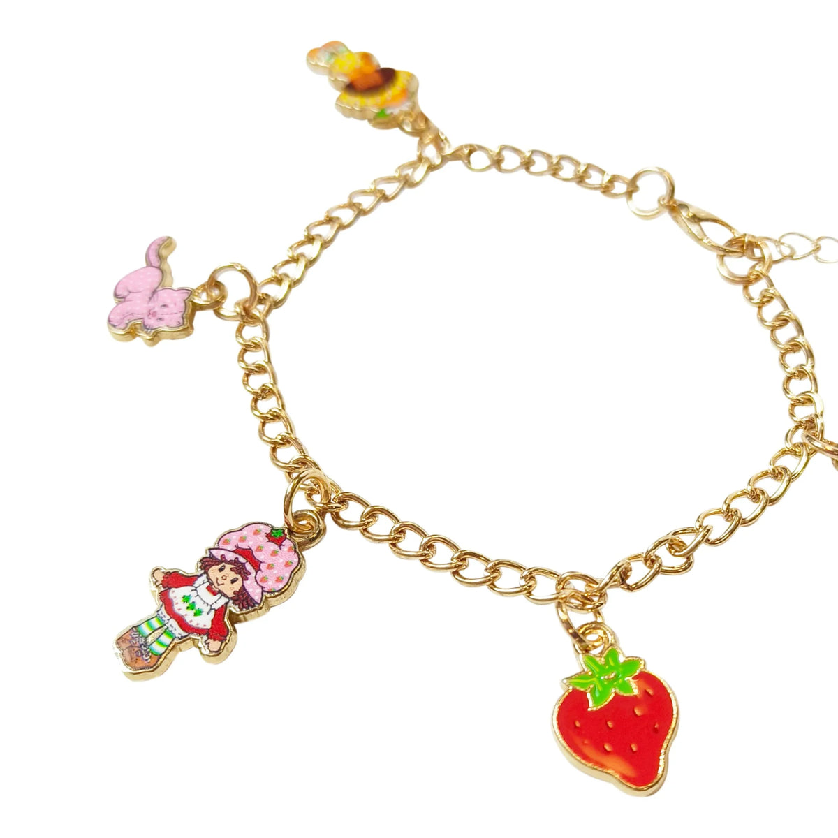Strawberry Shortcake Charm Bracelet with strawberry, character, and pink cat charms on gold chain