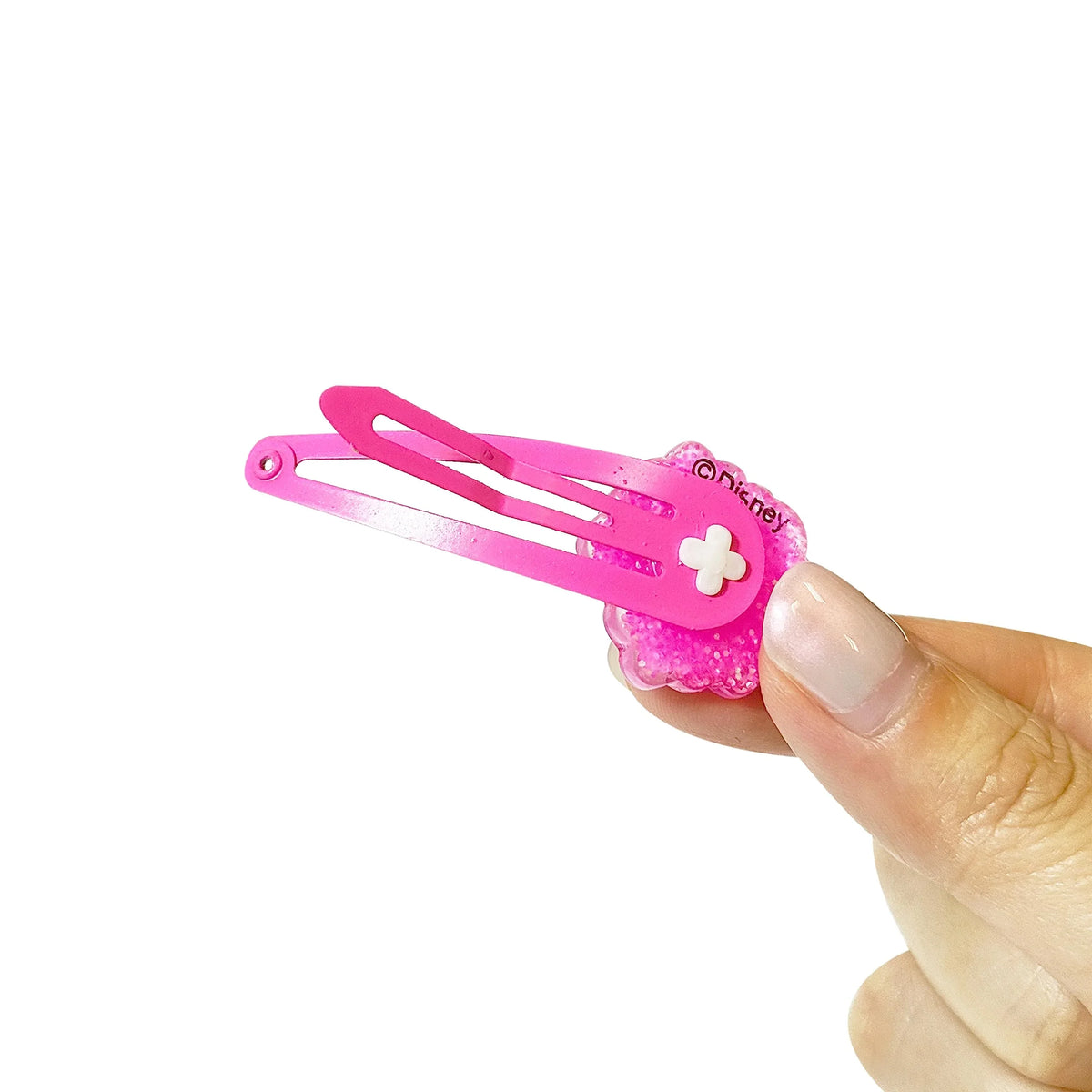 Disney Minnie Mouse pink glitter hair clip with flower detail, held by hand from LuvHer Shop