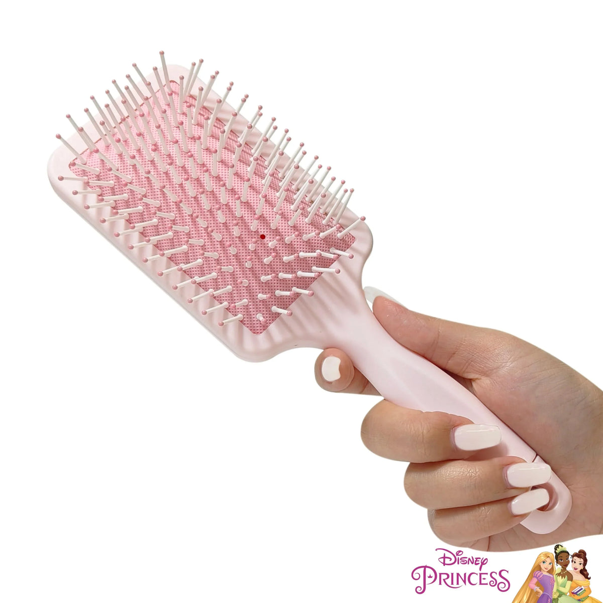 Disney Princess paddle hair brush for girls with pink bristles, held in a hand