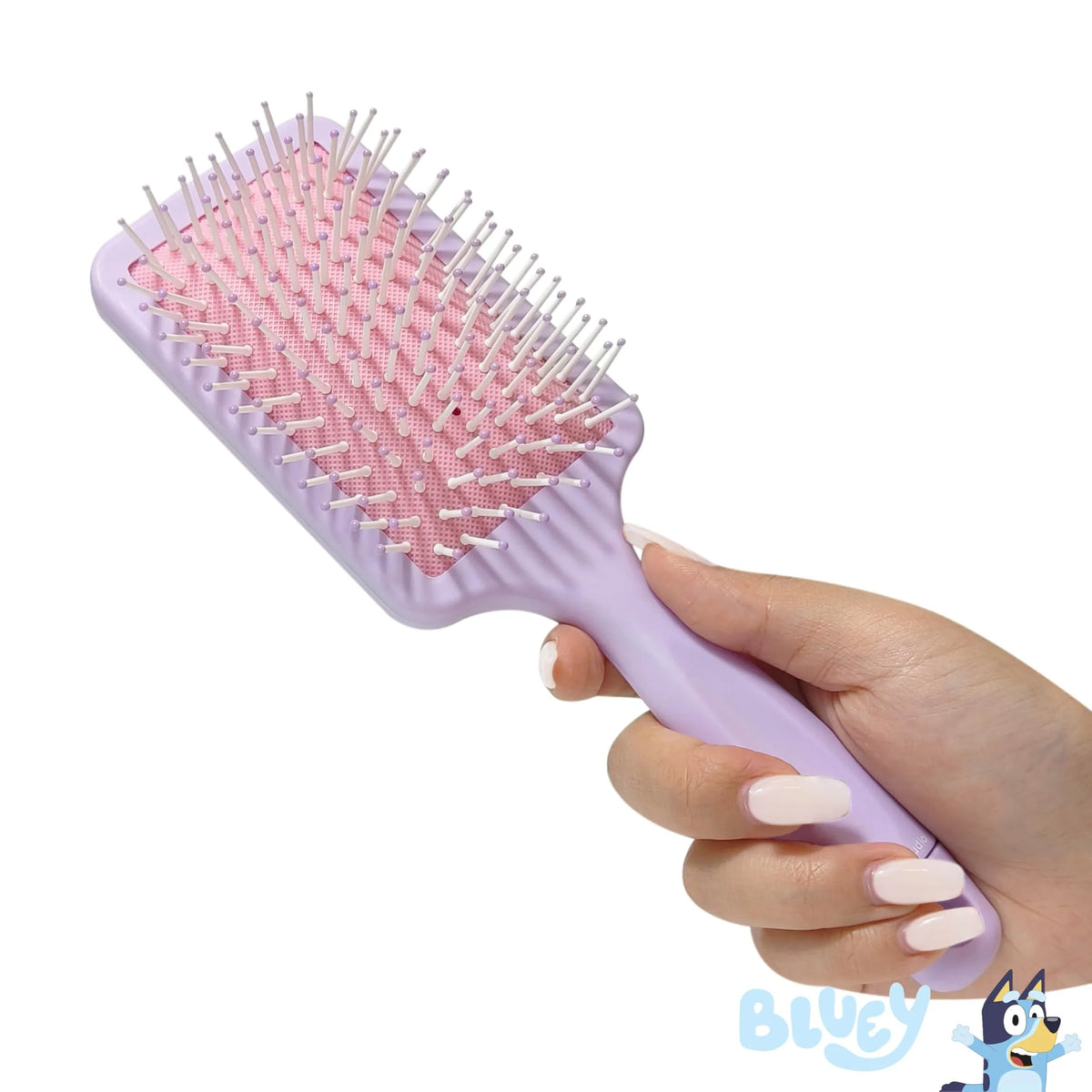Hand holding Bluey Paddle Hair Brush with pink bristles, LuvHer Shop girls' accessory