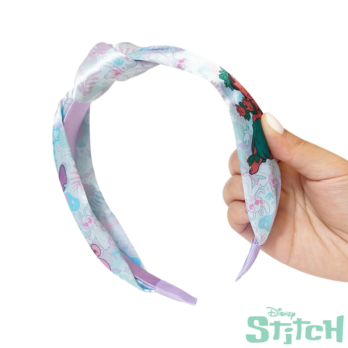 LuvHer Shop Disney Stitch headband with pastel floral and Stitch design held in hand