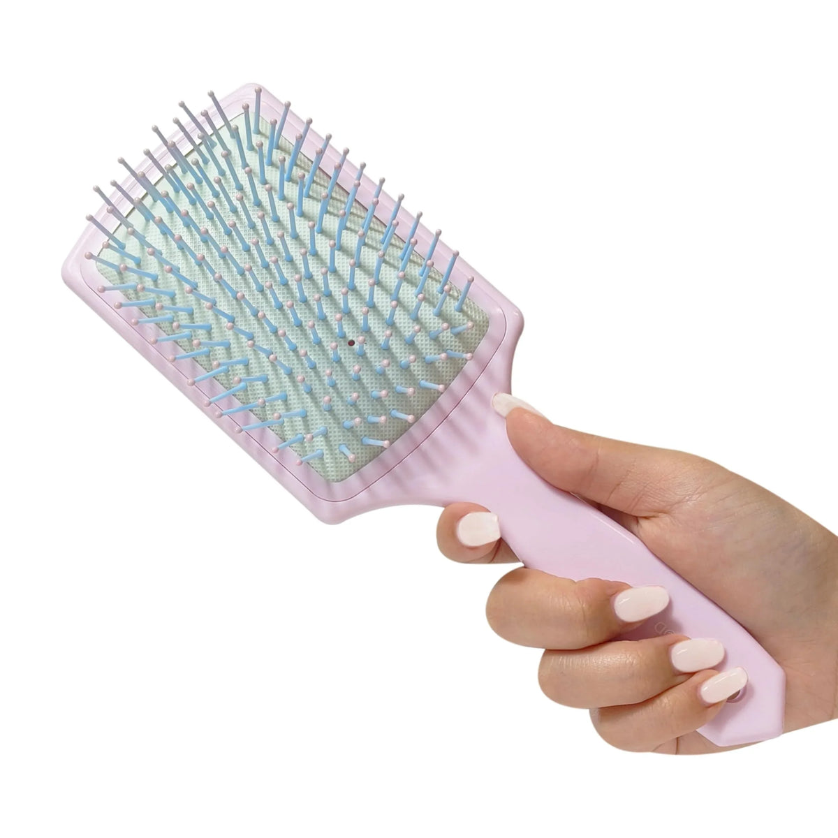 LuvHer Shop Paddle Hair Brush in pastel pink, held in a hand, girls' hair accessory