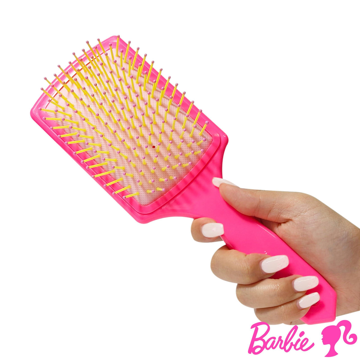 Barbie paddle hair brush pink with yellow bristles, held in hand, official licensed accessory