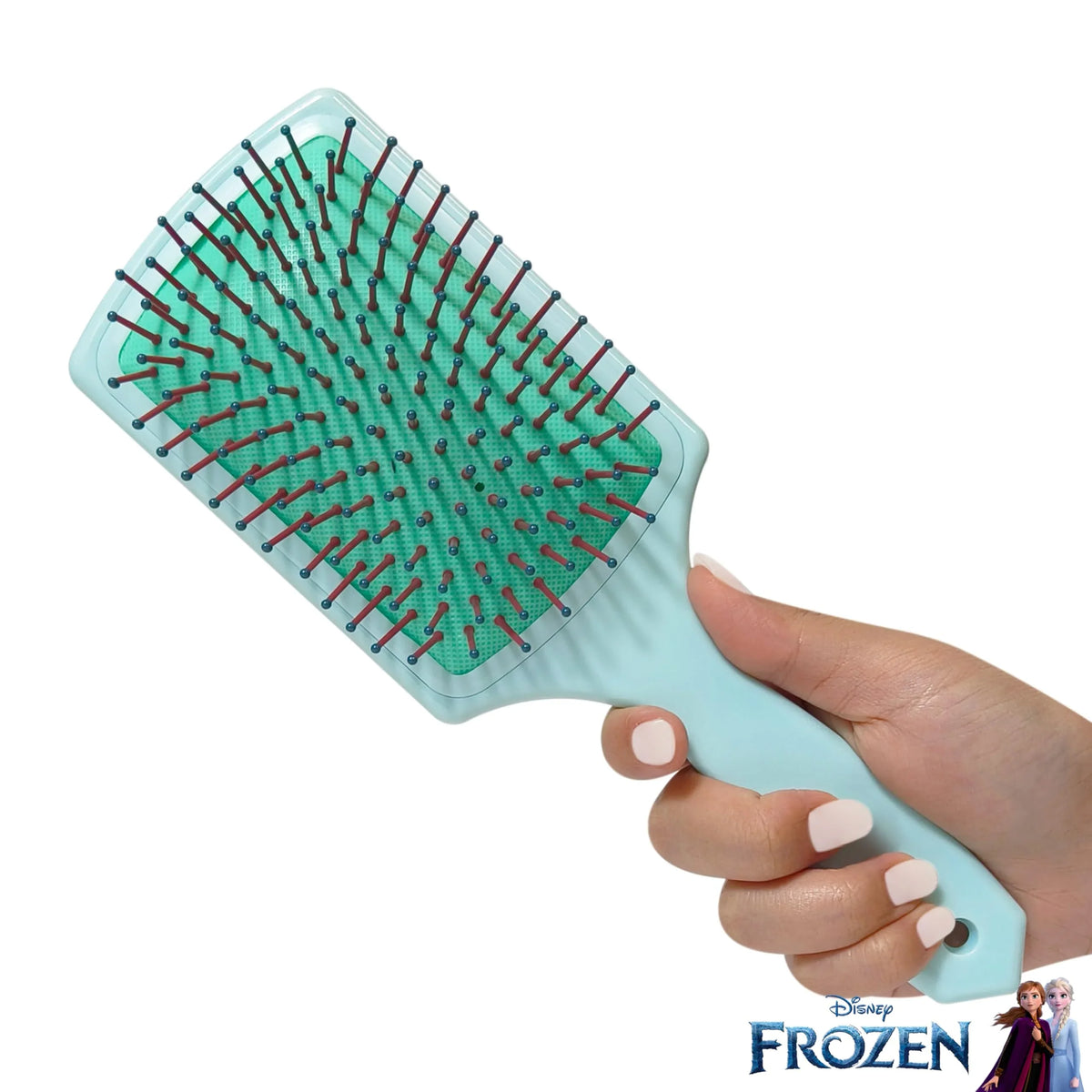 Hand holding Disney Frozen hair brush paddle by LuvHer Shop, light blue with Anna and Elsa logo