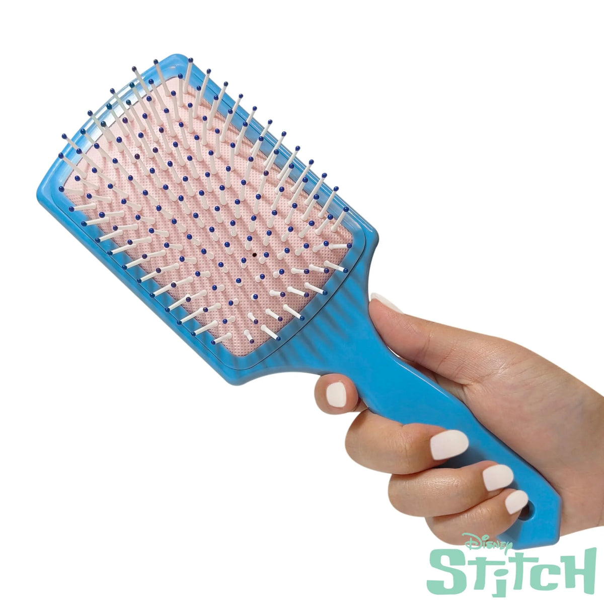 Disney Stitch blue paddle hair brush for girls, held in hand, official LuvHer Shop accessory