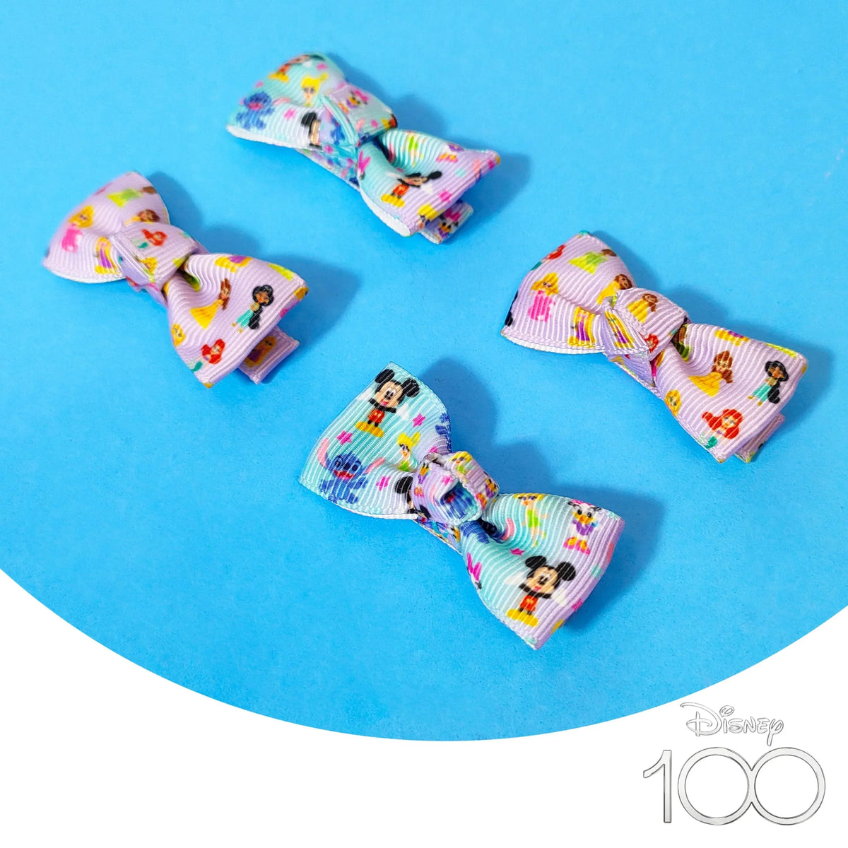 Disney 100 hair bows for girls with Disney character prints on blue background, LuvHer Shop
