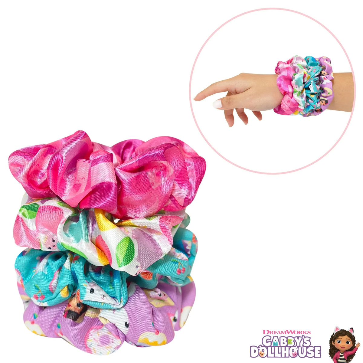 Gabby's Dollhouse scrunchies set with colorful prints, shown on wrist and stacked, girls' hair accessory