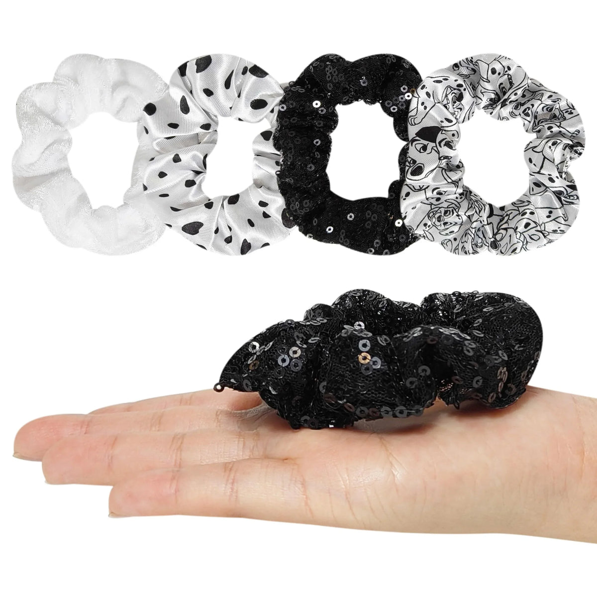 Disney 101 Dalmatians Scrunchies set with black and white hair ties, shown on a hand