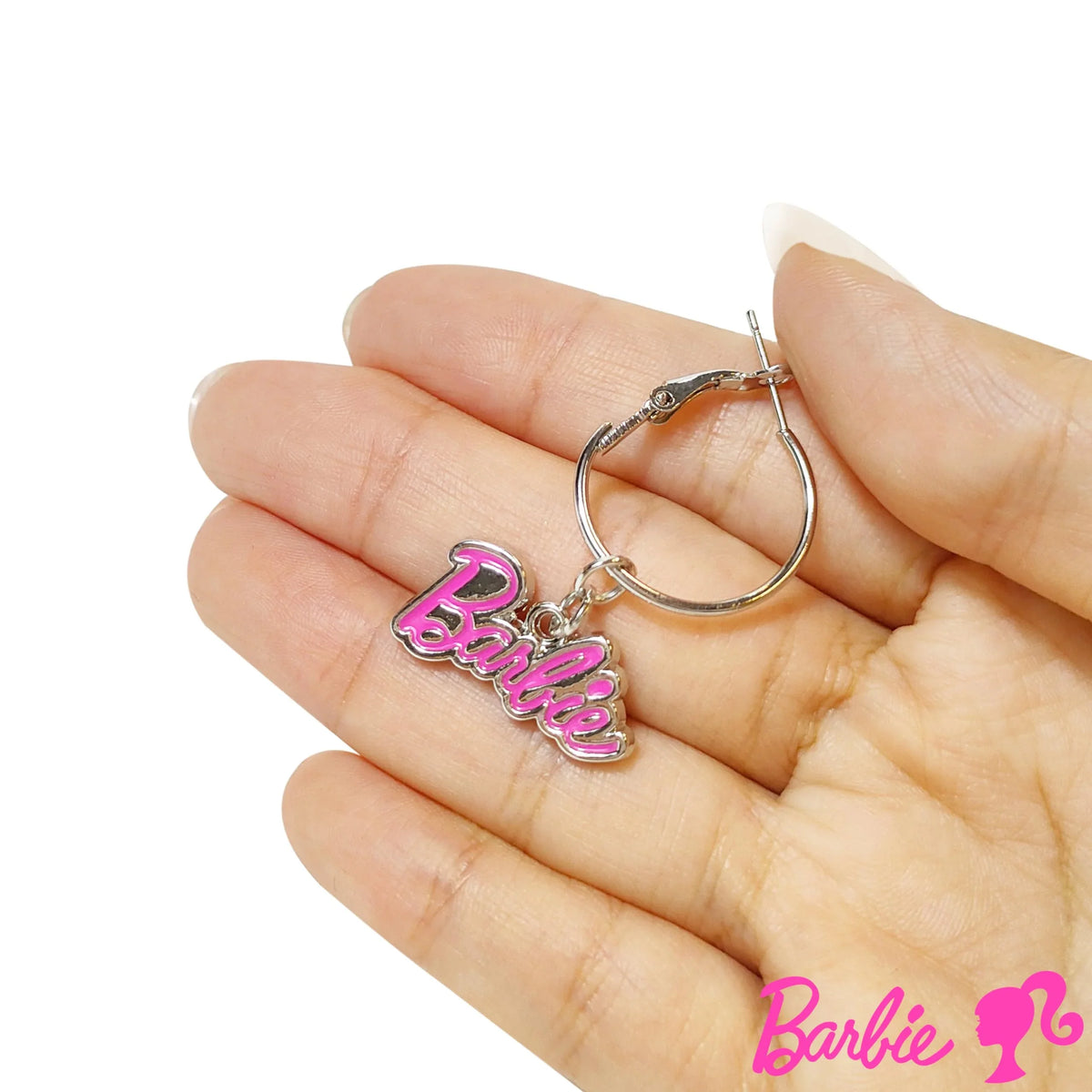 Barbie pink logo hoop earring held in hand, girls' official licensed jewelry from LuvHer Shop