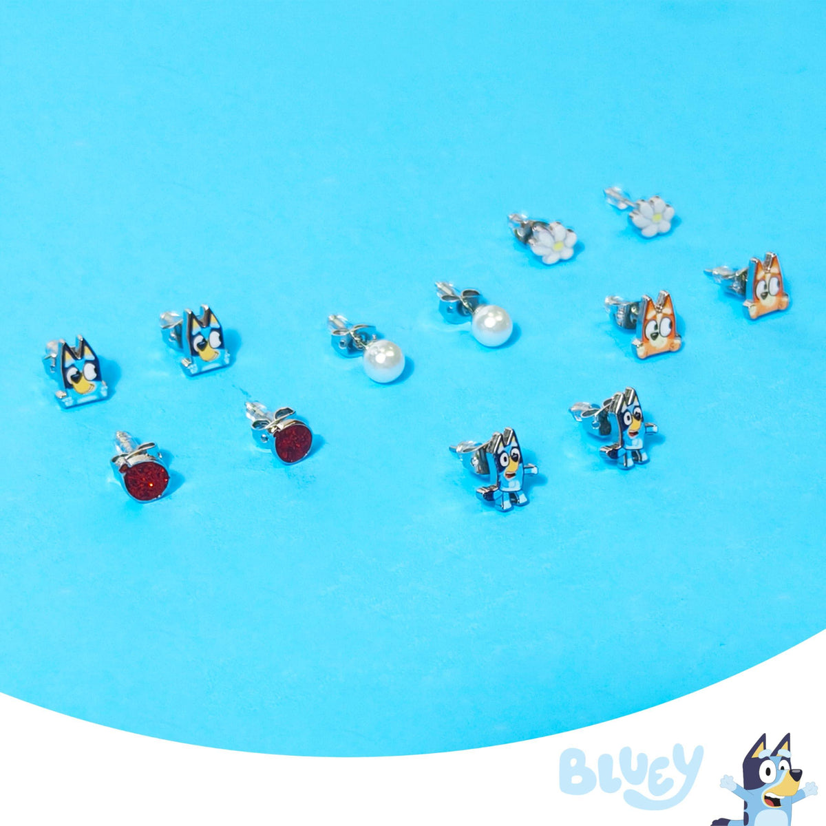 Bluey stud earring set featuring Bluey, Bingo, daisies, pearls, and glitter designs on blue background
