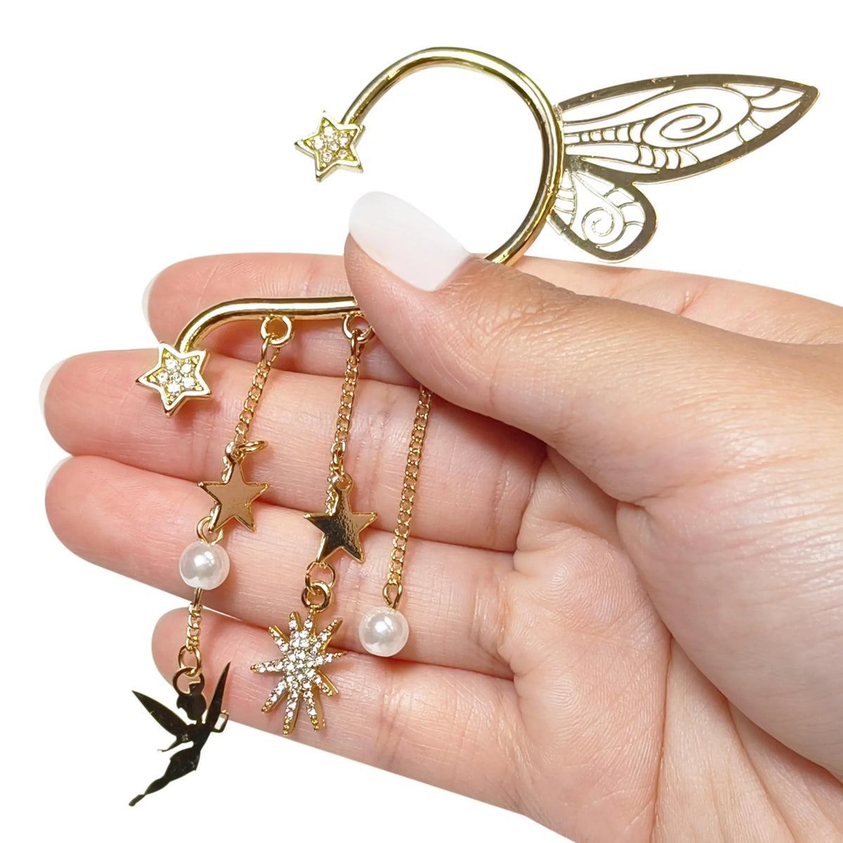 Hand holding Tinker Bell Disney ear cuff with gold stars, fairy charm, pearls by LuvHer Shop