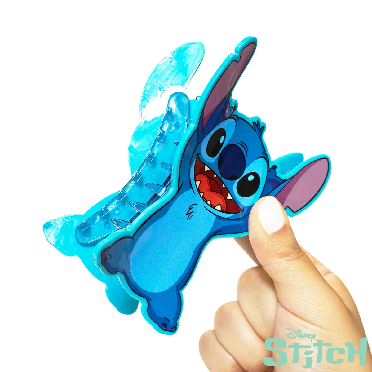 Disney Stitch hair clip accessory from LuvHer Shop, shaped like Stitch, held in hand