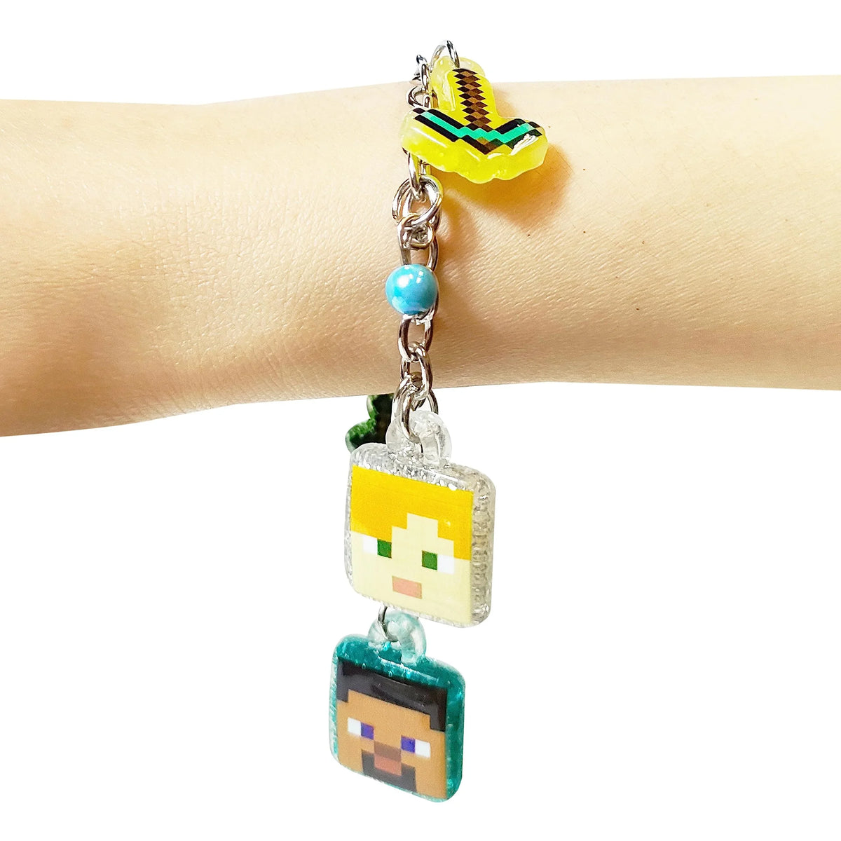 Minecraft charm bracelet with pixelated Steve and Alex charms on wrist, LuvHer Shop accessory