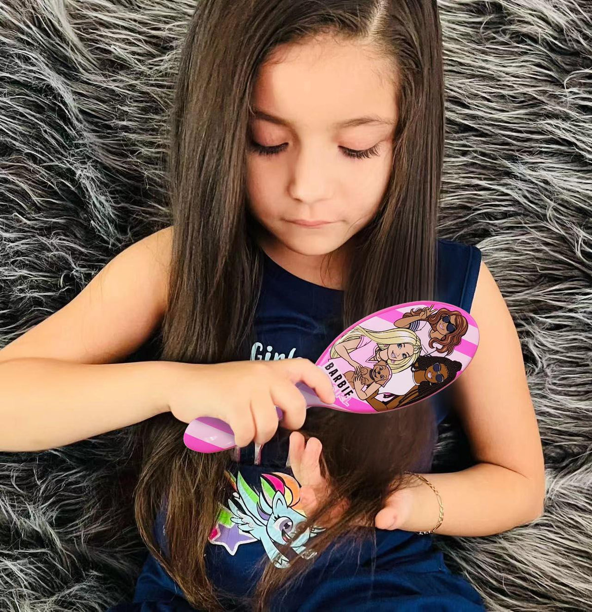 Girl brushing hair with Barbie hair brush, licensed girls' accessory from LuvHer Shop