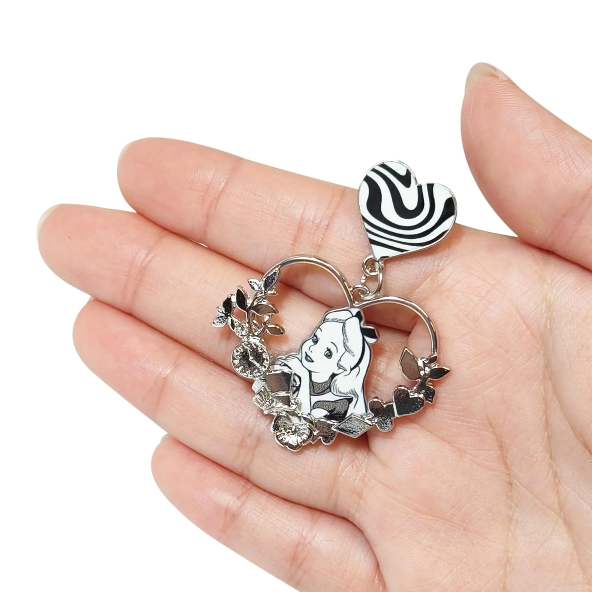 Alice in Wonderland heart pendant charm with rhinestones from LuvHer Shop, held in hand