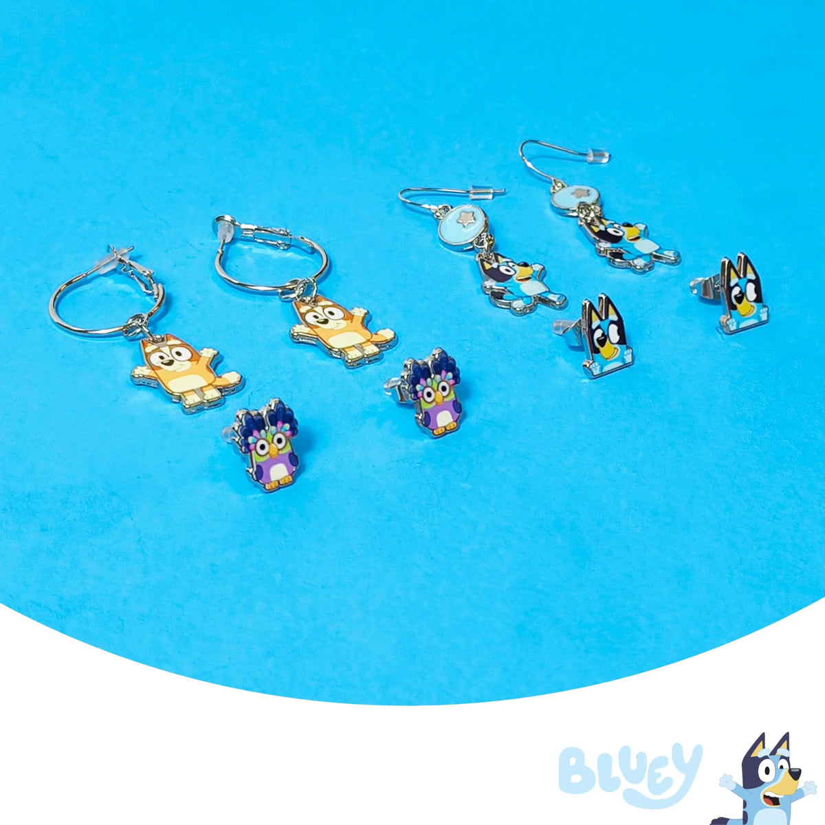 Bluey earring set featuring Bluey, Bingo, and other character studs on a blue background, LuvHer Shop