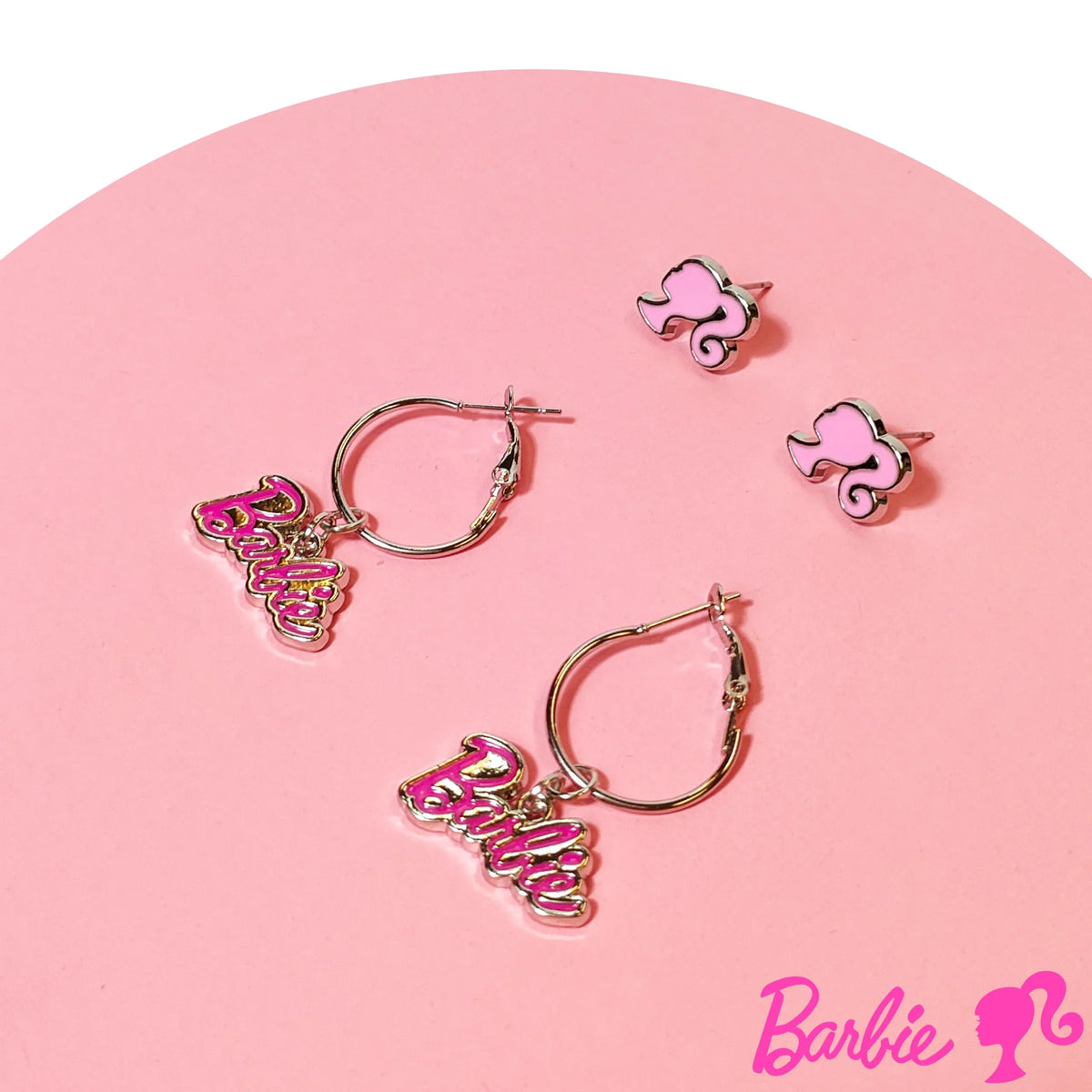 Barbie earrings set with pink logo studs and hoop earrings on pink background, LuvHer Shop
