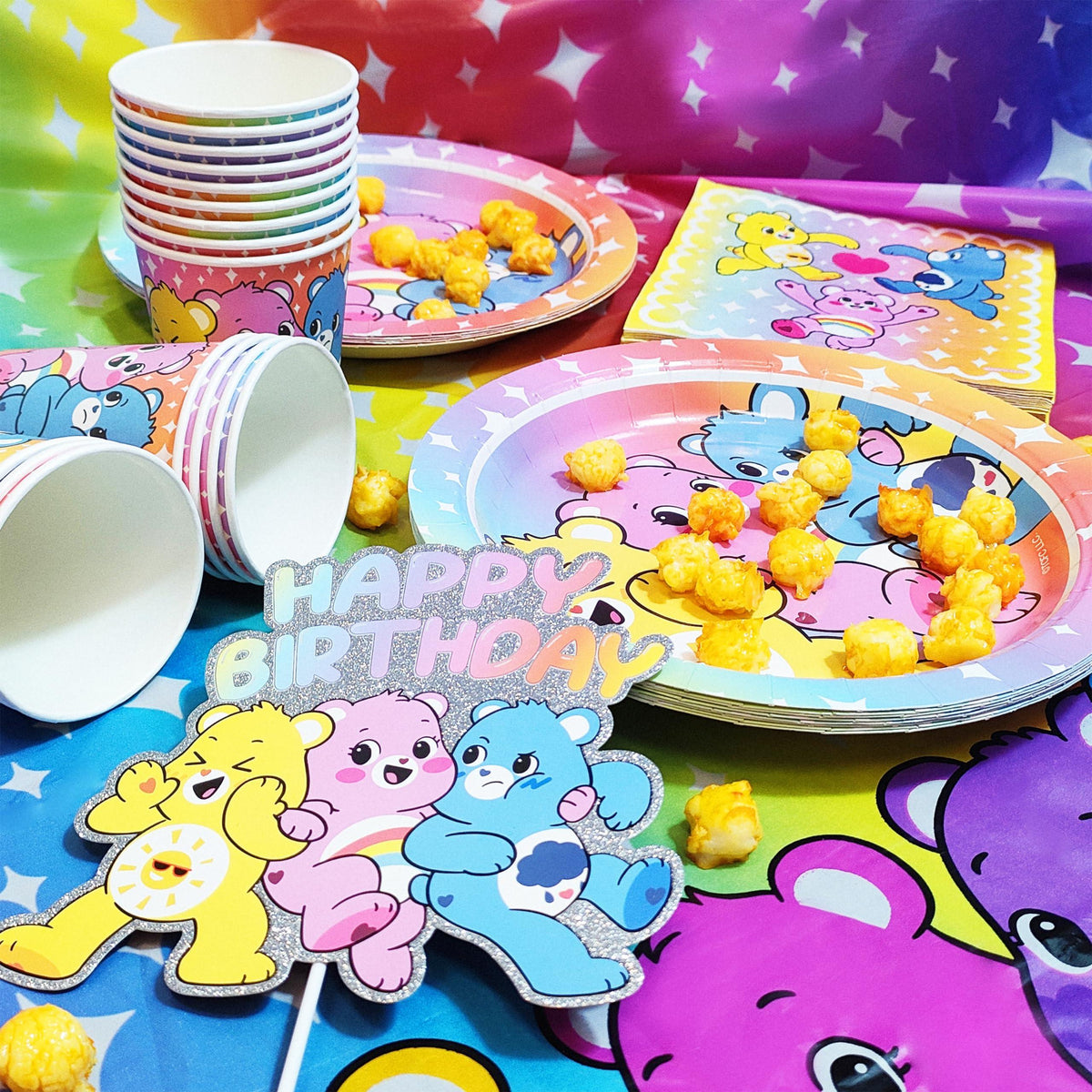 Care Bears birthday party set with plates, cups, napkins, and colorful snacks, LuvHer Shop