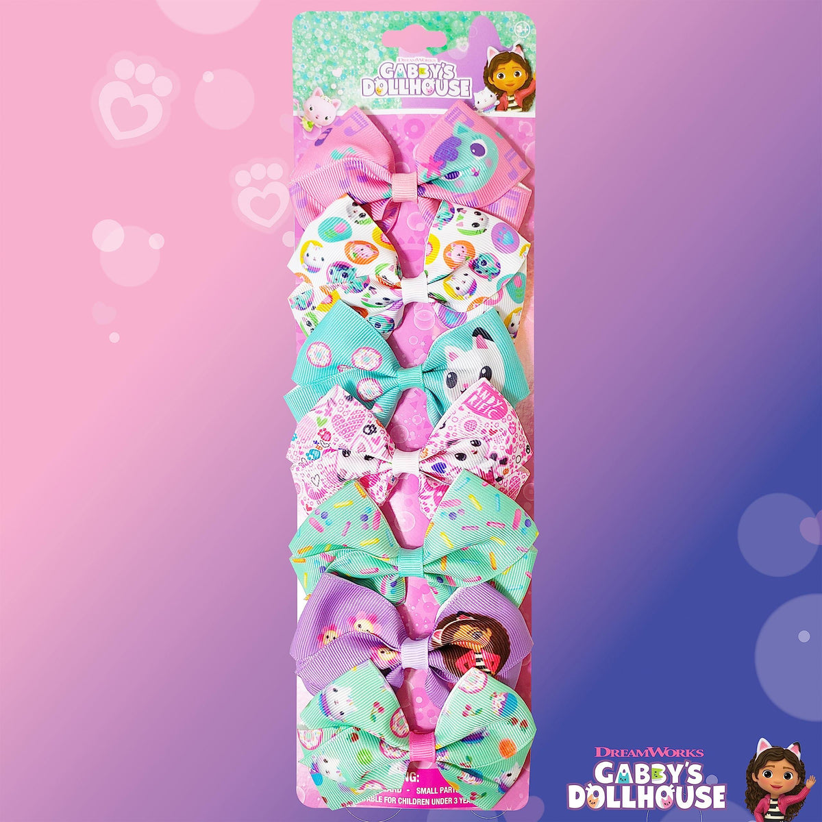 Gabby's Dollhouse hair bows set with colorful designs and cartoon characters on display card